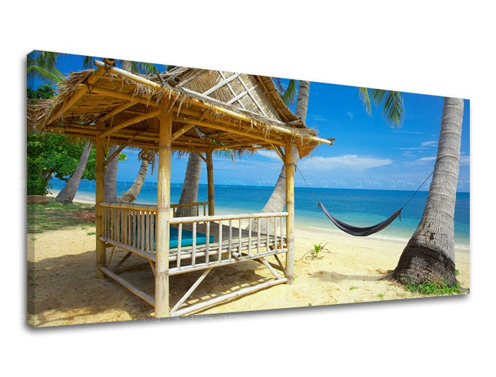 U boho stilu slika na platnu s motivom PANORAMA PLAŽA, palme, okean, plaža, more i plaža u bež-plavih nijansama, opuštajuća atmosfera, trodelna izvedba – glavna